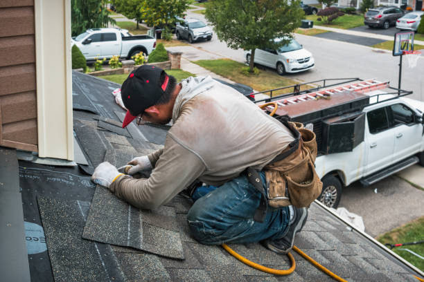 Professional Roofing technician working in West Newton, MA